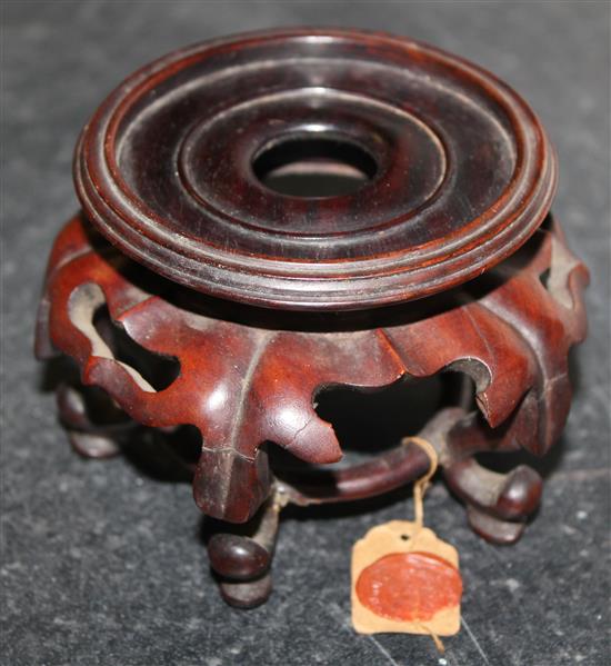 A collection of approximately thirty Chinese and Oriental hardwood stands, largest 18 x 10cm, smallest 3 x 2cm